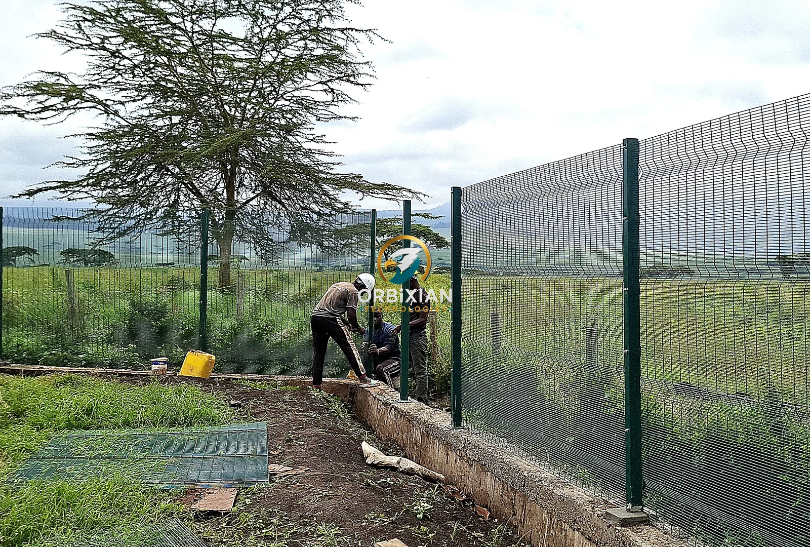 Clearview fence installers completing a residential perimeter in Nakuru