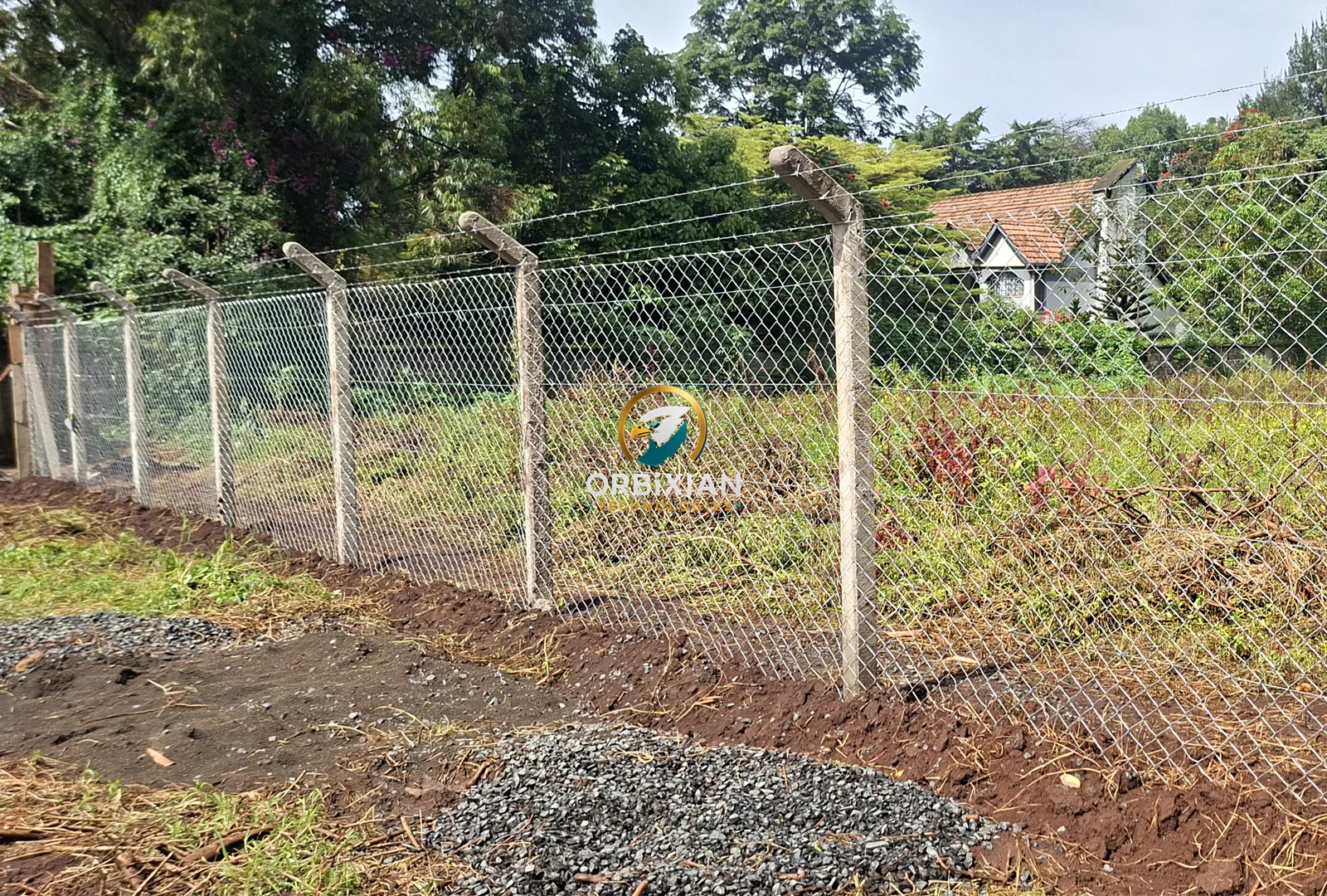 7ft chainlink fence installation in Gachie using precast concrete poles and barbed wire